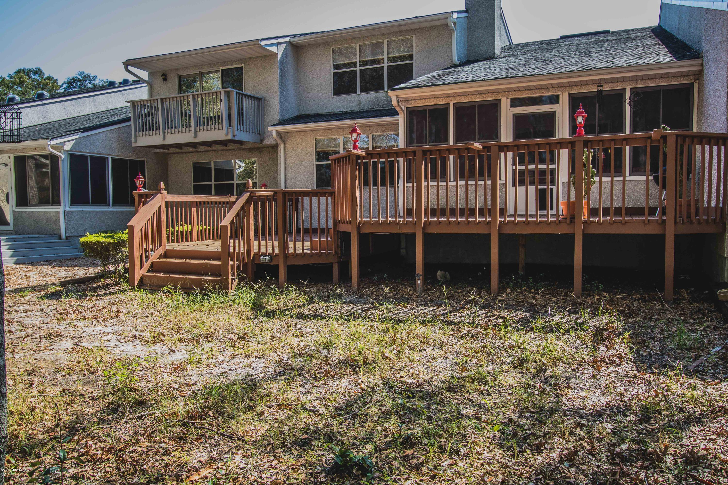 3123 Ravines Road Middleburg, FL 32068 - Photo 30 of 32 a backyard of a house with barbeque oven and trees