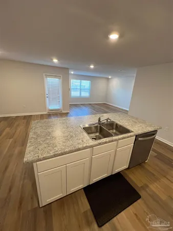 a view of a kitchen counter space and sink
