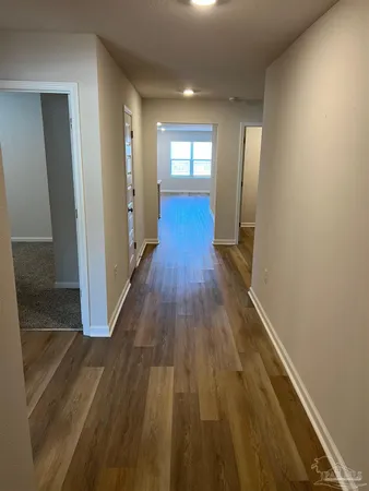 wooden floor in a hall with an entryway