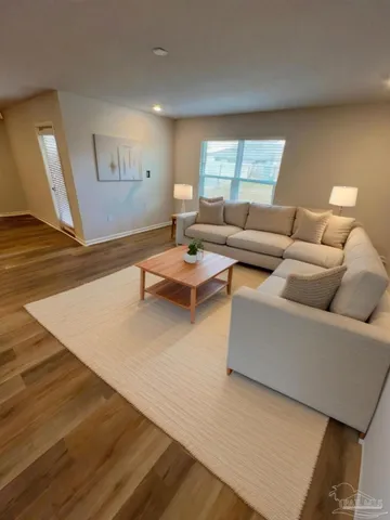 a living room with furniture and a window