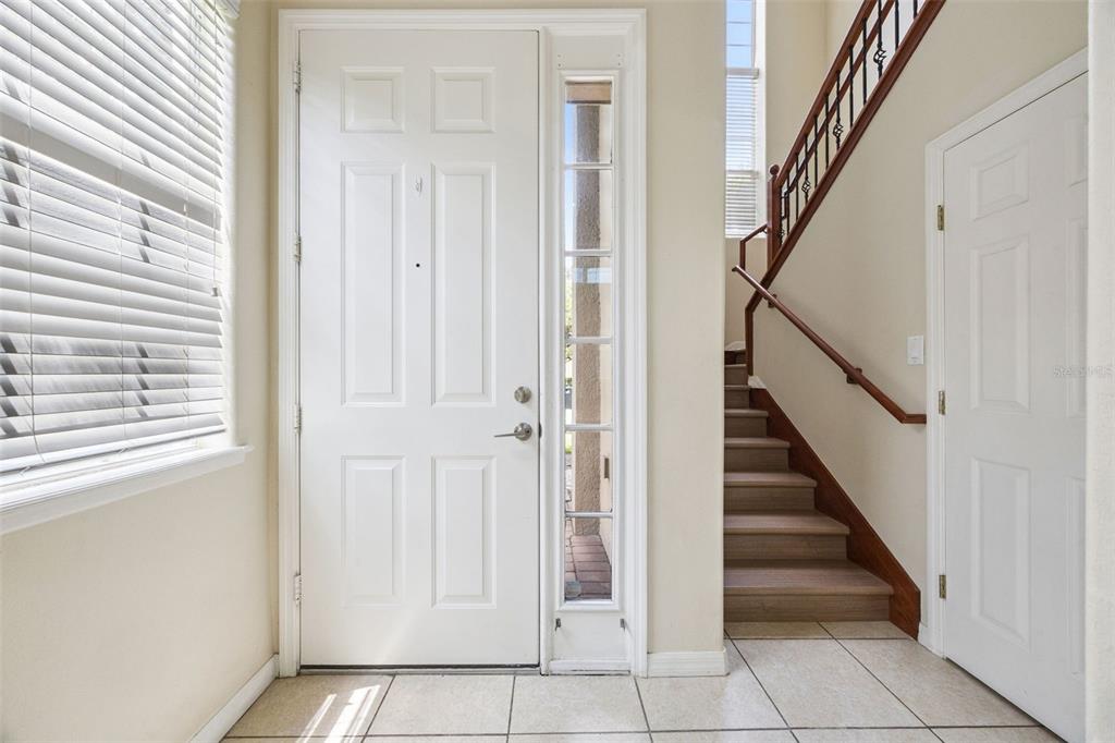 551 Terrace Spring Drive Orlando, FL 32828 - Photo 16 of 41 a view of an entryway with staircase
