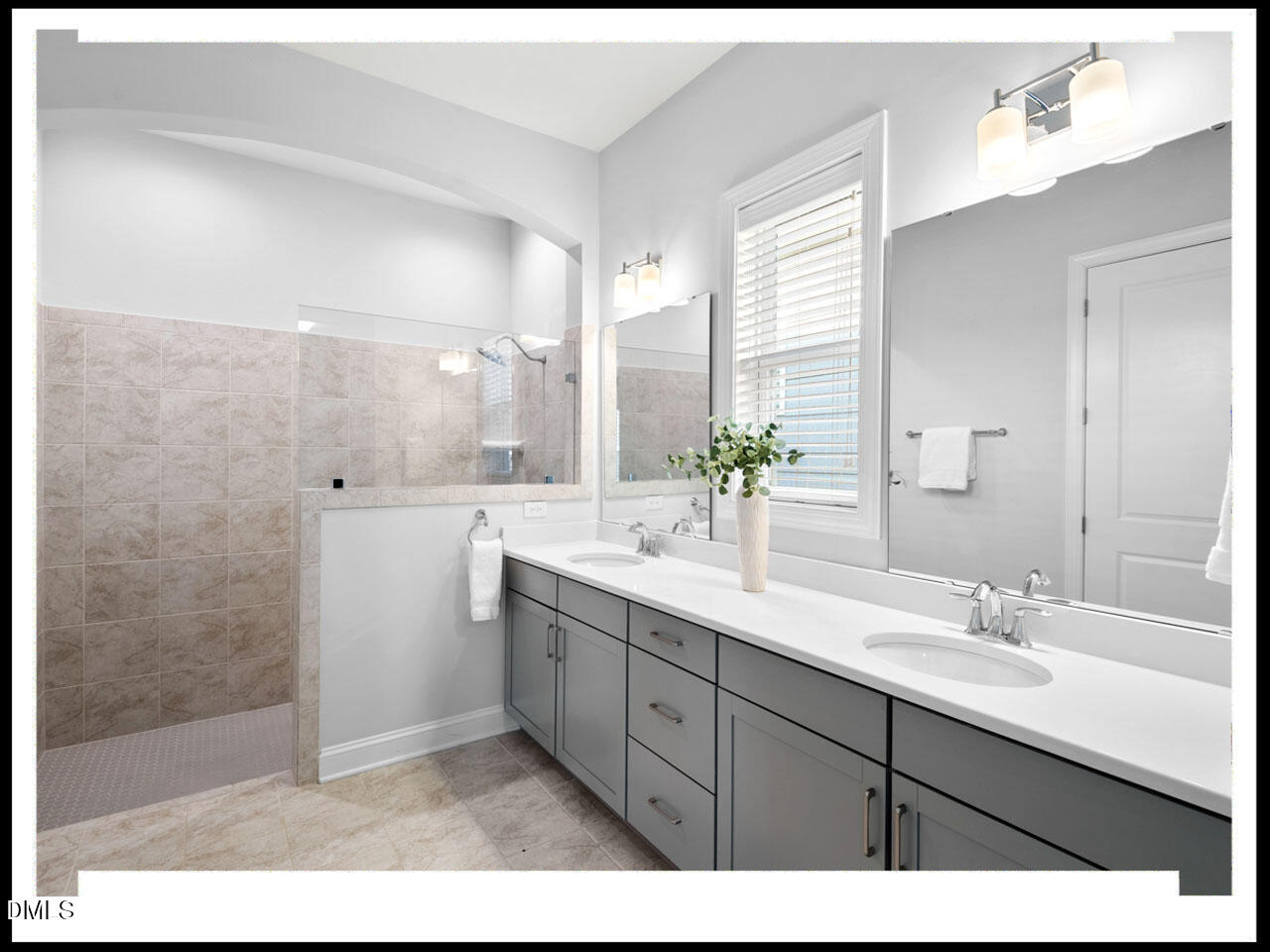 153 Abercorn Circle Chapel Hill, NC 27516 - Photo 32 of 51 a bathroom with a sink double vanity mirror and a shower