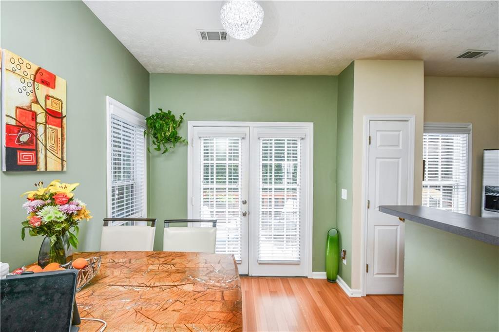 1609 Indian Way Cumming, GA 30040 - Photo 25 of 72 a living room with furniture and a potted plant