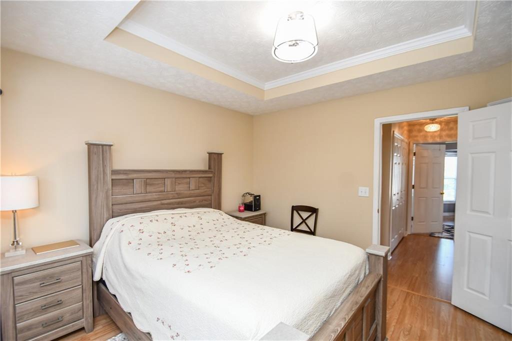 1609 Indian Way Cumming, GA 30040 - Photo 42 of 72 a bedroom with a bed and a table