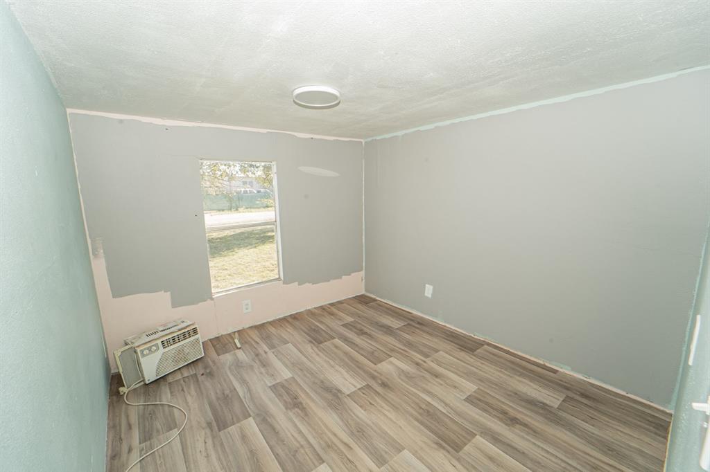 516 South Butte Street Breckenridge, TX 76424 - Photo 17 of 17 a view of empty room with wooden floor and fan