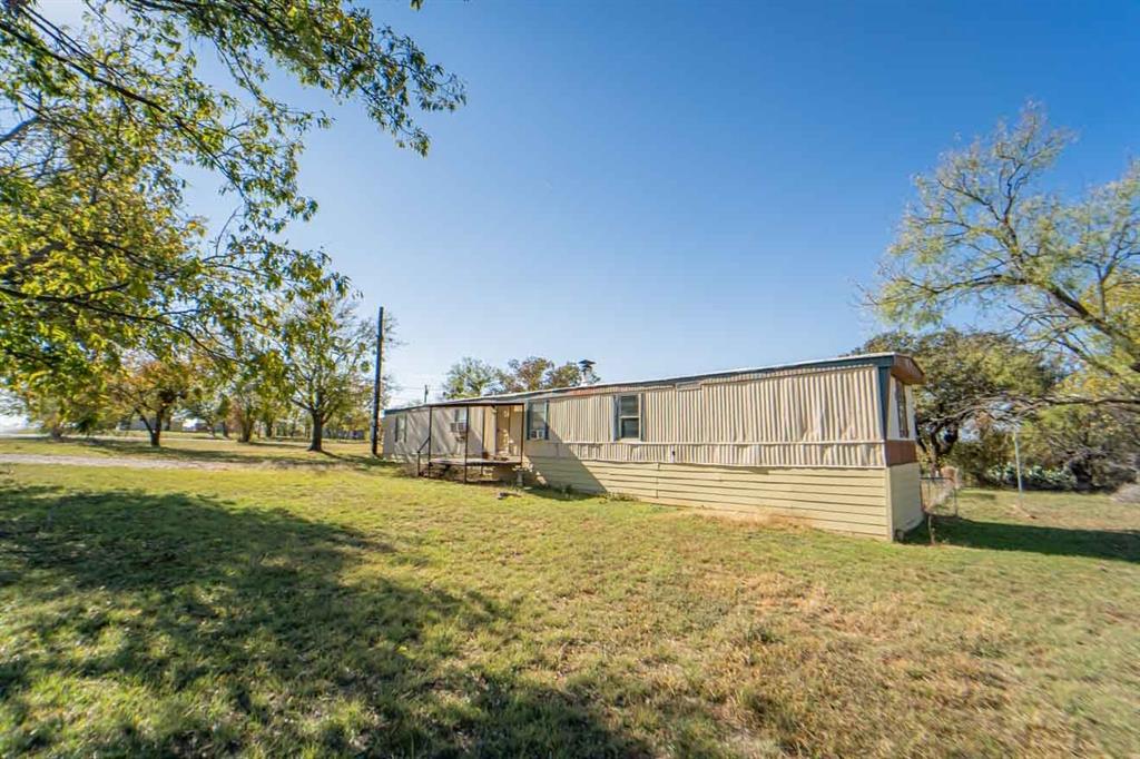 516 South Butte Street Breckenridge, TX 76424 - Photo 3 of 17 a view of swimming pool with an outdoor space and seating area