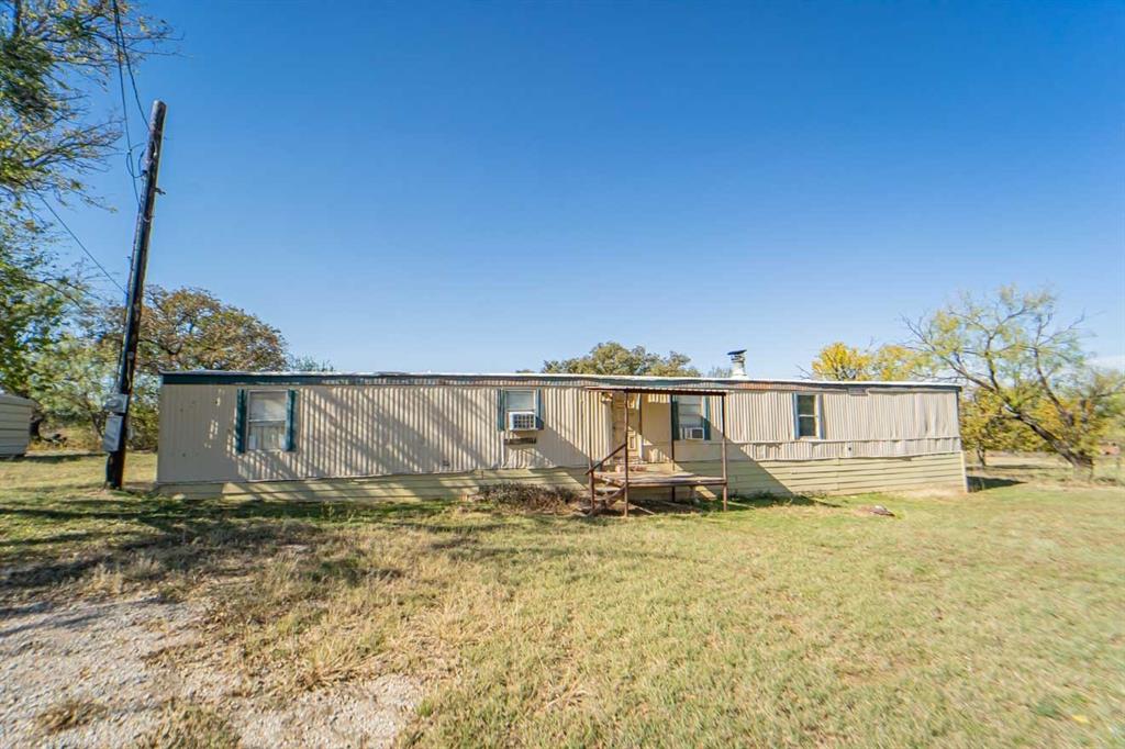 516 South Butte Street Breckenridge, TX 76424 - Photo 5 of 17 a front view of a house with a yard