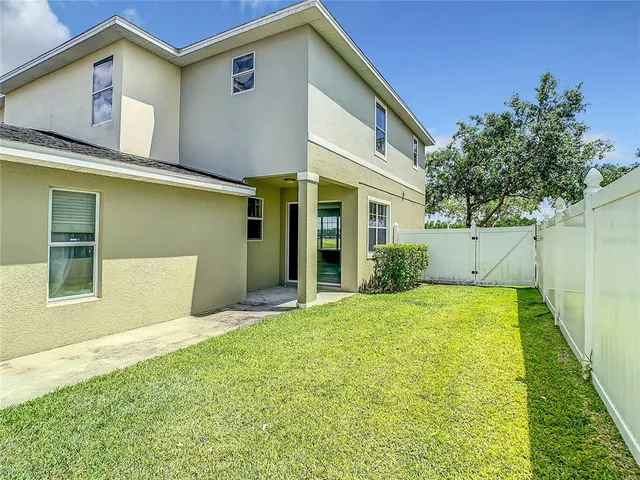 a view of a house with outdoor space pool patio and outdoor seating