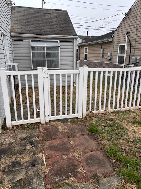 3419 Sollers Point Road Baltimore, MD 21222 - Photo 5 of 23 Fenced yard at front showing addition.