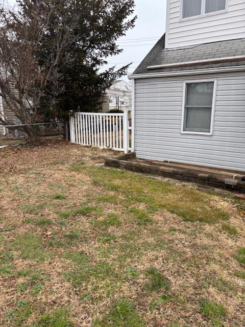 3419 Sollers Point Road Baltimore, MD 21222 - Photo 6 of 23 Yard with a white vinyl fence.