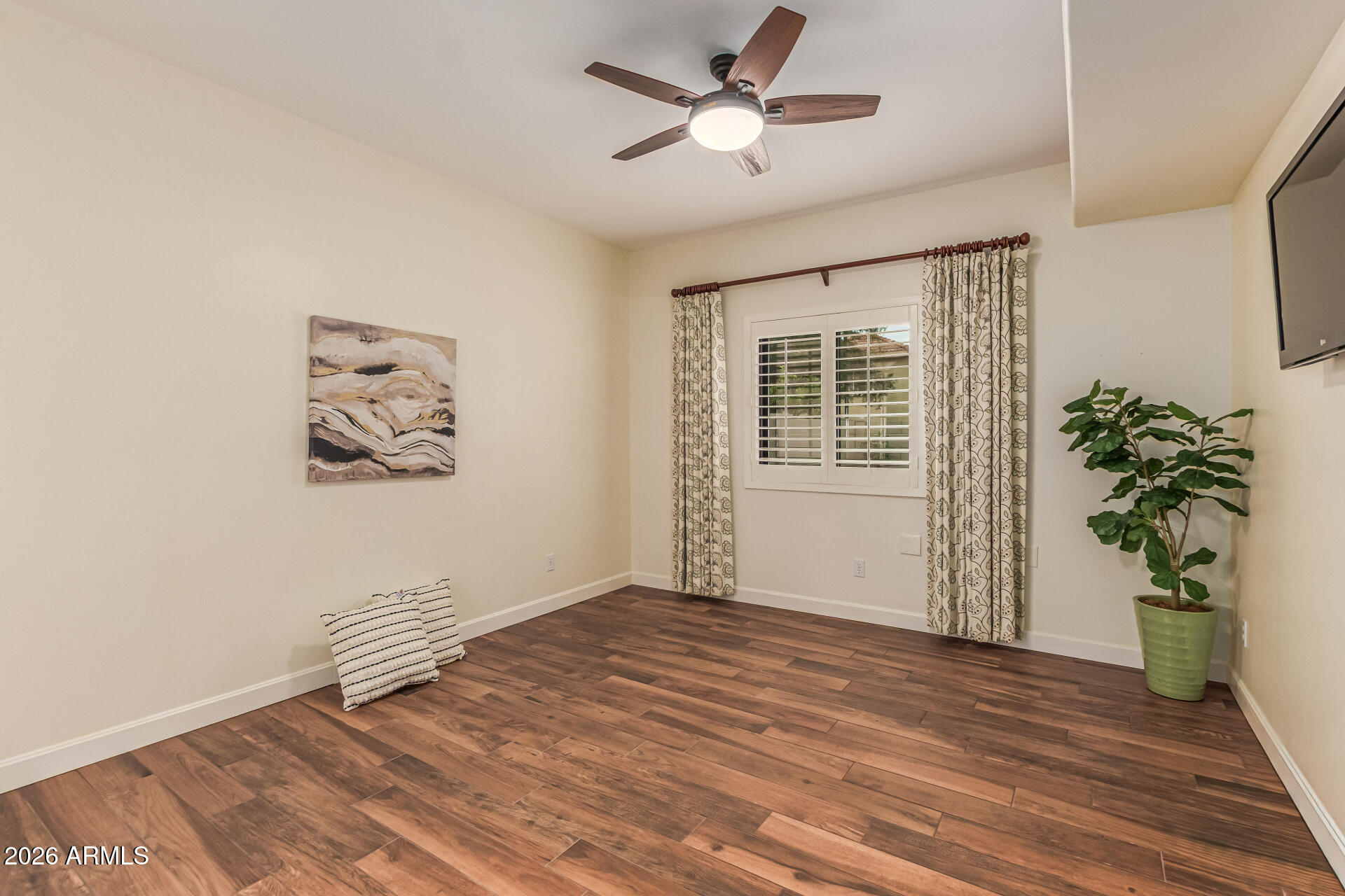 5445 East McKellips Road, Unit 25 Mesa, AZ 85215 - Photo 14 of 32 a view of empty room with wooden floor