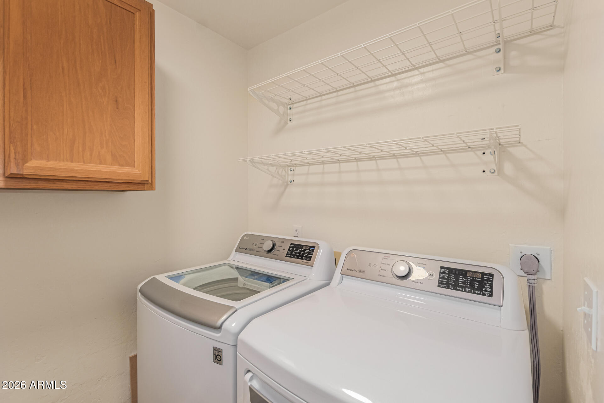 5445 East McKellips Road, Unit 25 Mesa, AZ 85215 - Photo 23 of 32 a utility room with dryer and washer