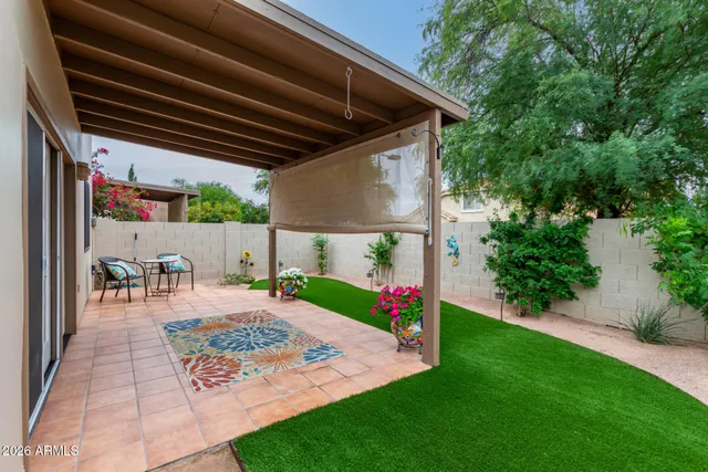 a view of yard with patio