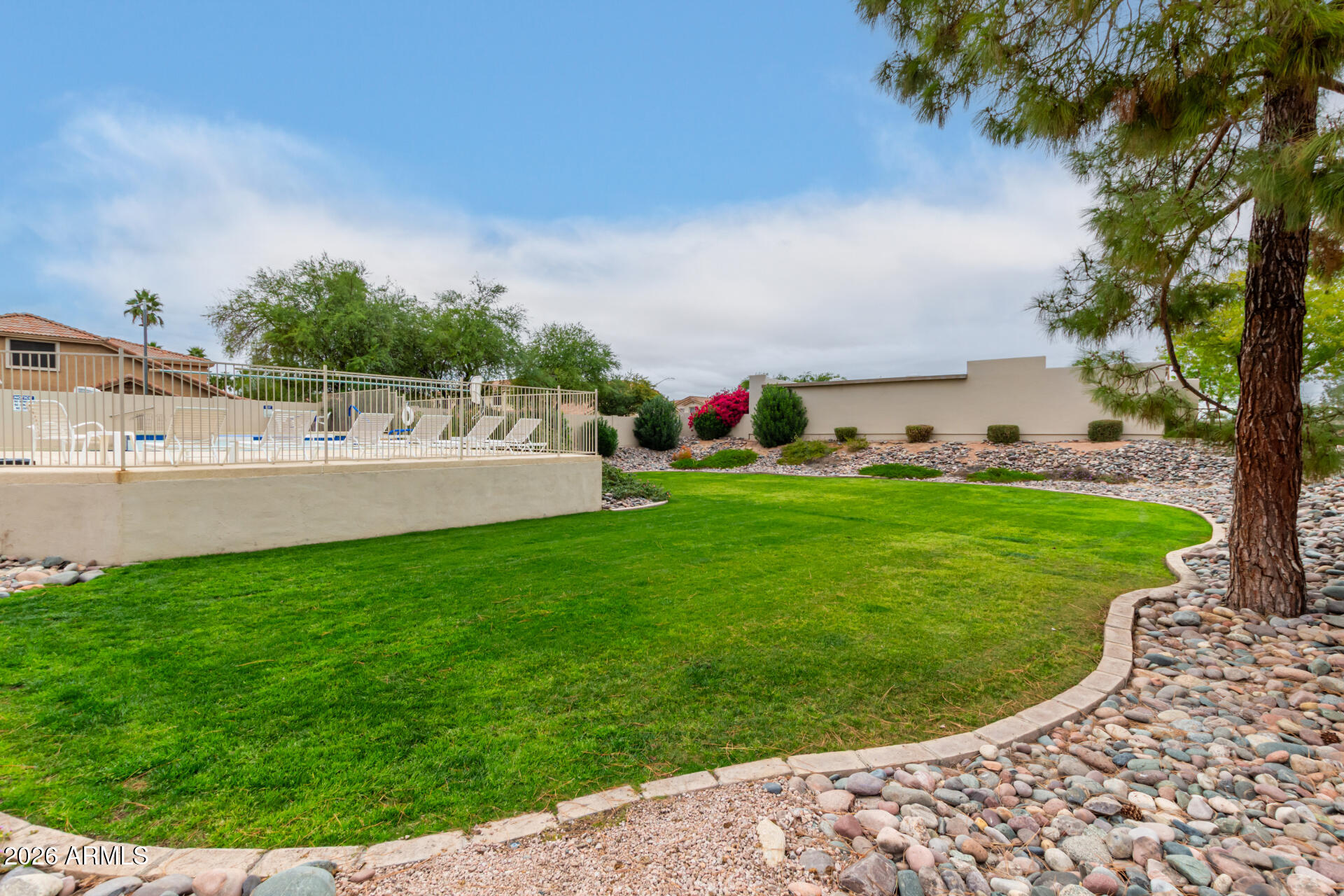 5445 East McKellips Road, Unit 25 Mesa, AZ 85215 - Photo 28 of 32 a view of a golf course with a garden