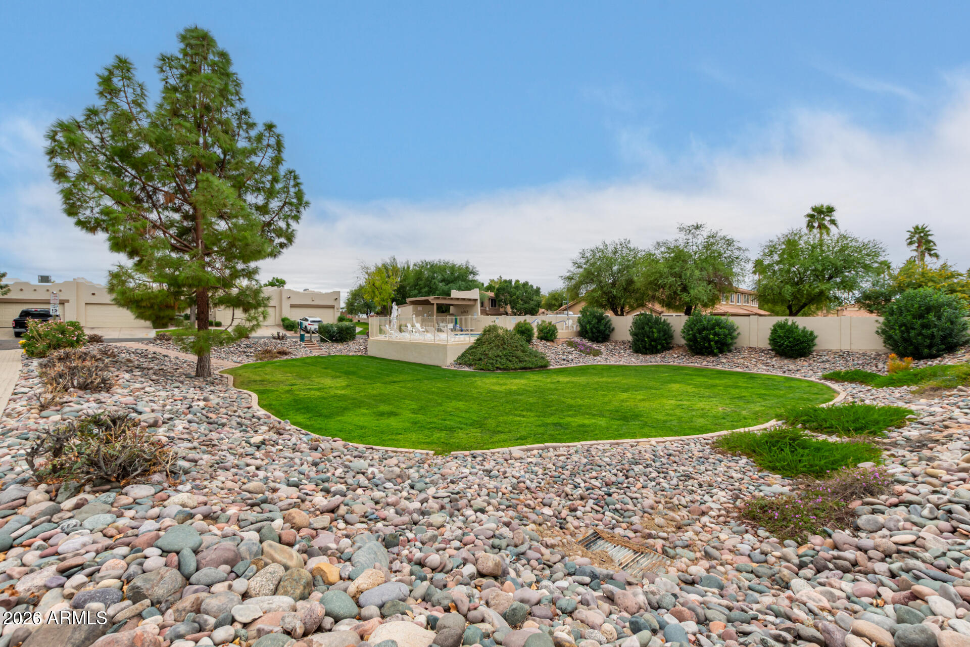 5445 East McKellips Road, Unit 25 Mesa, AZ 85215 - Photo 28 of 32 a view of a garden with houses