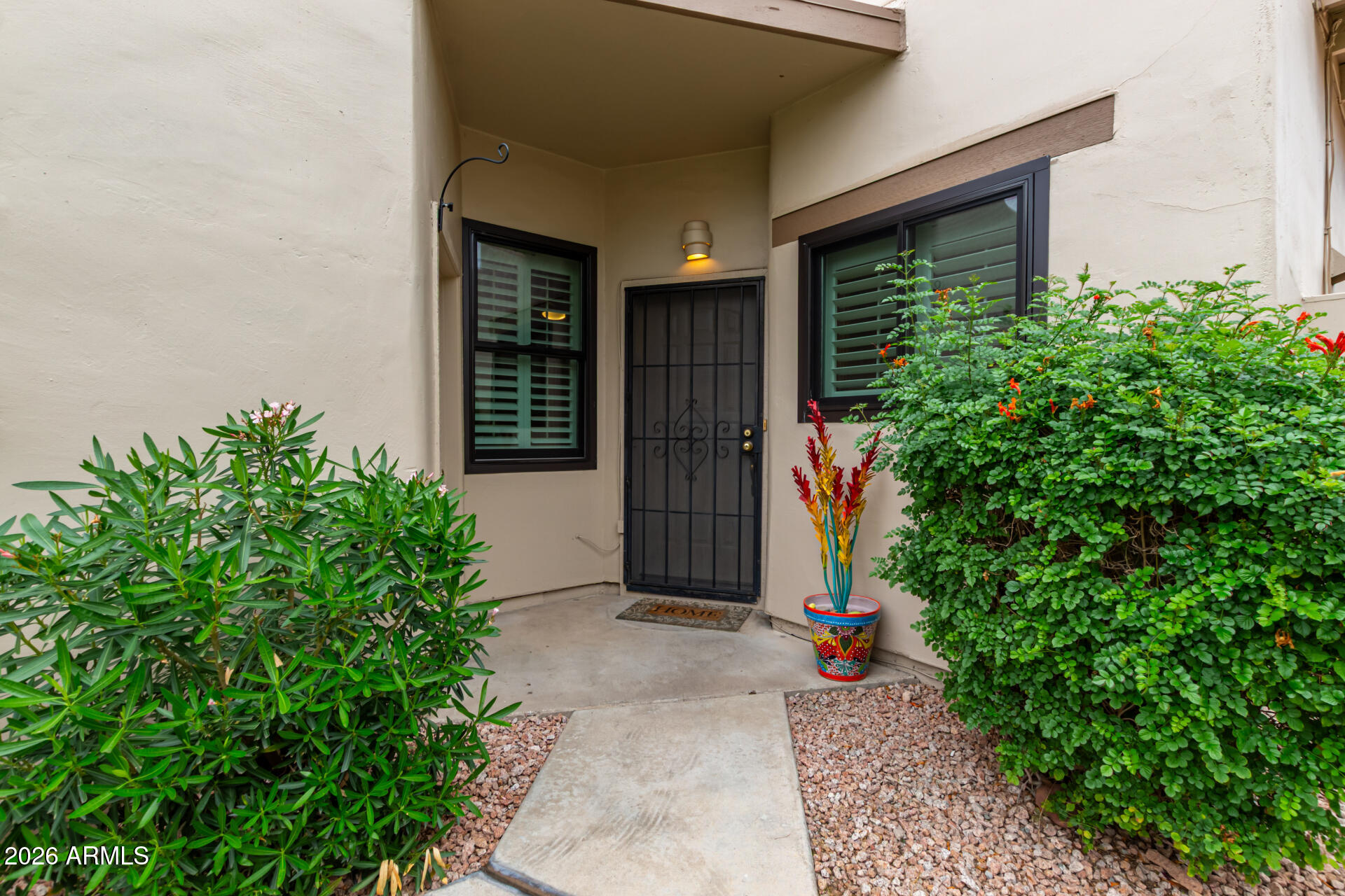 5445 East McKellips Road, Unit 25 Mesa, AZ 85215 - Photo 32 of 32 a view of a garage with potted plants