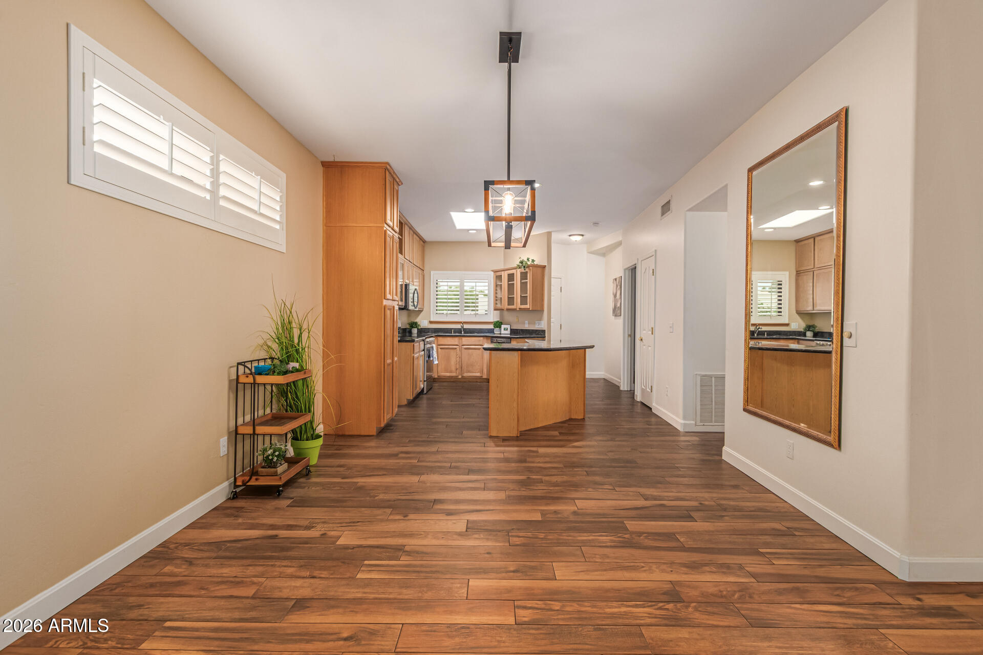 5445 East McKellips Road, Unit 25 Mesa, AZ 85215 - Photo 8 of 32 a view of a kitchen from the hallway