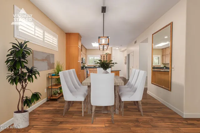 a view of a dining room with furniture window and wooden floor