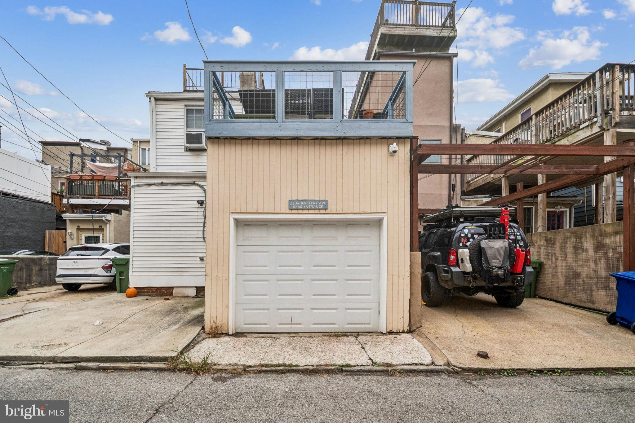 1134 Battery Avenue Baltimore, MD 21230 - Photo 25 of 30 a front view of a house with a garage