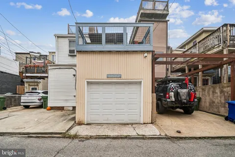 a front view of a house with a garage