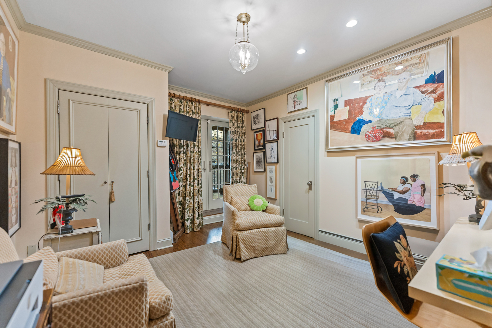 26 East Scott Street, Unit 3 Chicago, IL 60610 - Photo 27 of 35 a living room with furniture and a flat screen tv