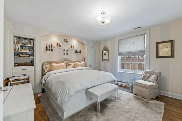 a bedroom with a bed and dresser