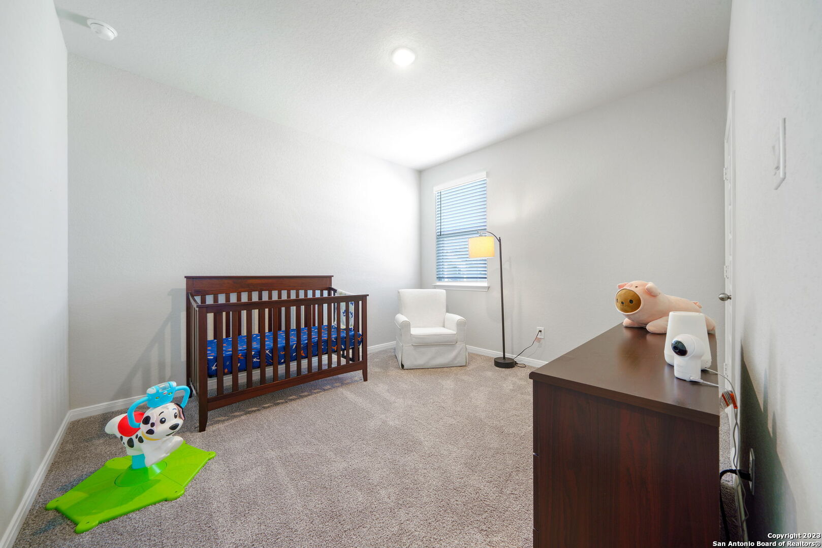5151 Longhorn River Converse, TX 78109 - Photo 19 of 25 a bedroom with a bed and a window