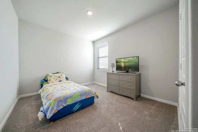 a bedroom with a bed and furniture