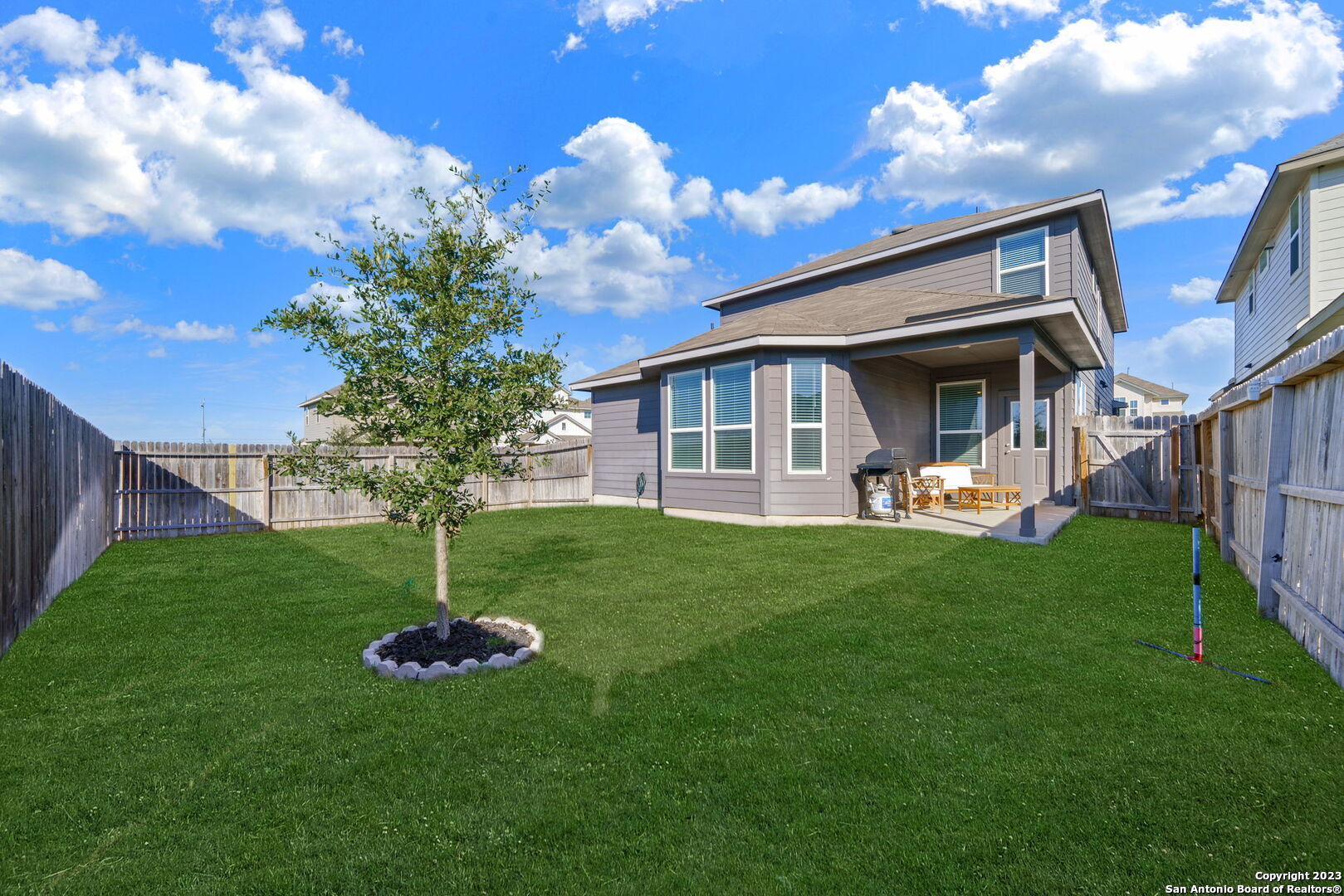 5151 Longhorn River Converse, TX 78109 - Photo 24 of 25 a front view of a house with a garden