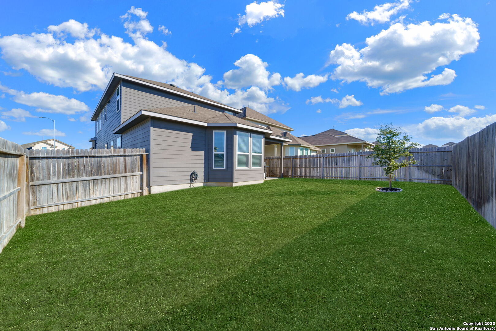 5151 Longhorn River Converse, TX 78109 - Photo 25 of 25 a backyard of a house with a garden and deck