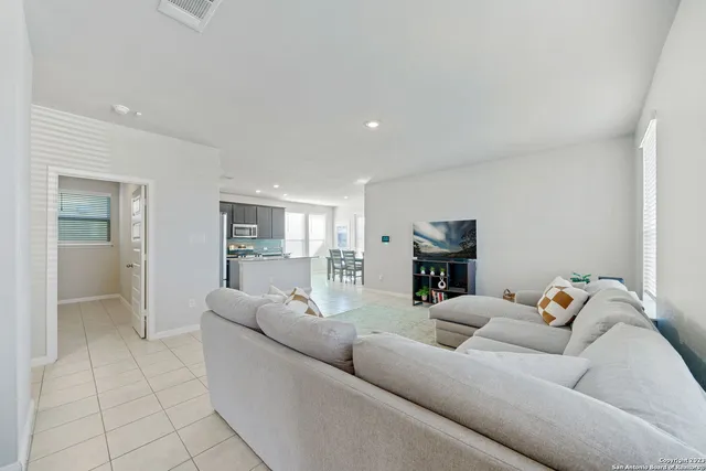 a living room with furniture and a couch