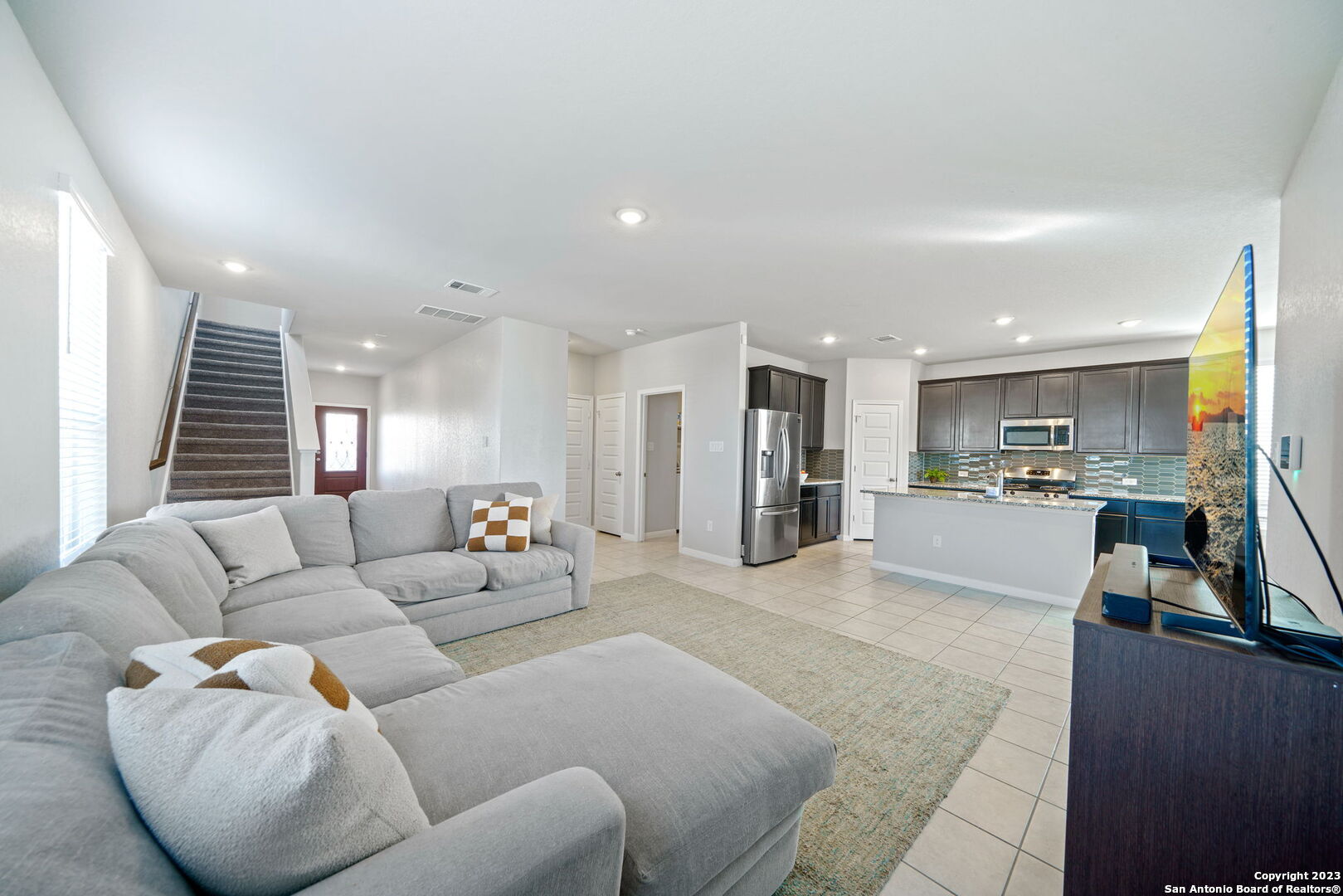 5151 Longhorn River Converse, TX 78109 - Photo 6 of 25 a living room with furniture and kitchen view