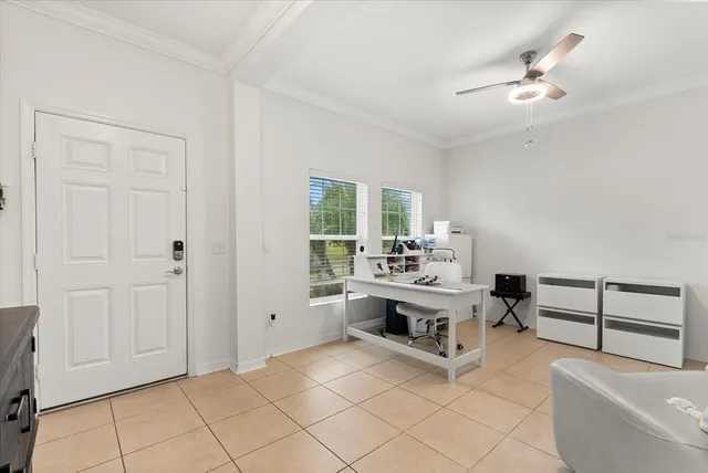 a living room with furniture and a lamp