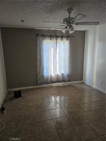 a view of an empty room and a window