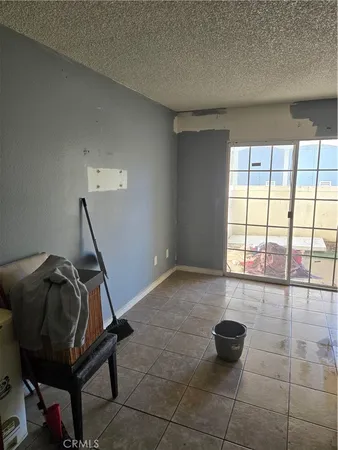 a room with gym equipment and a window