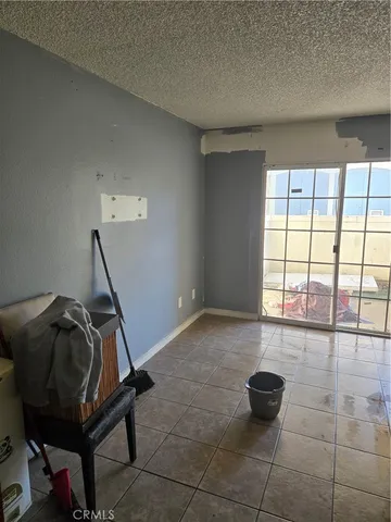 a room with gym equipment and a window