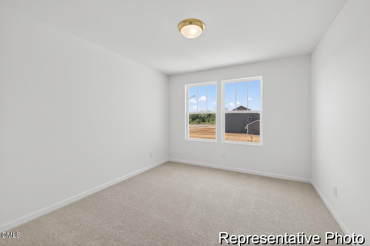 421 Plentiful Way, Unit 111 Benson, NC 27504 - Photo 22 of 27 a view of room and window