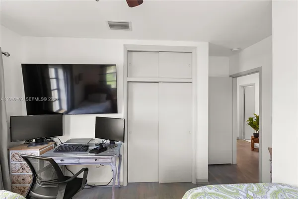 a workspace with furniture and wooden floor