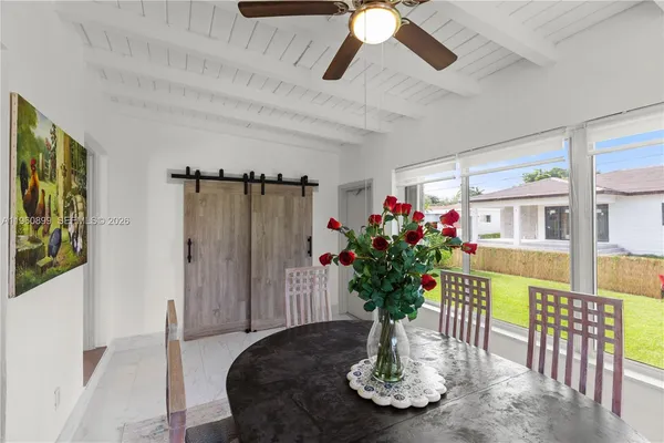 a view of a dining room with furniture window and wooden floor