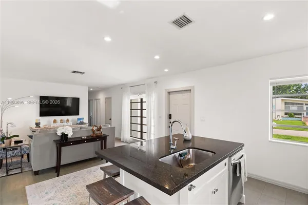 a living room with fireplace furniture and a flat screen tv