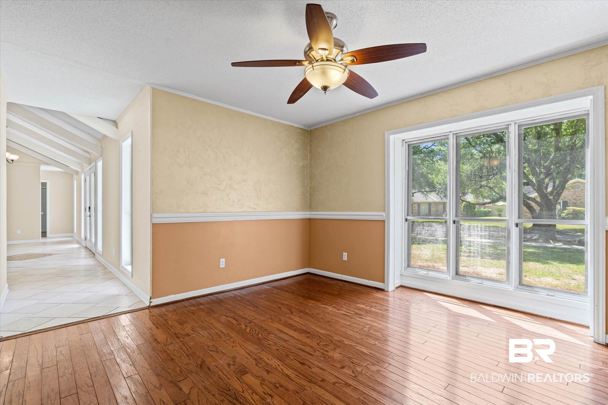3724 Claridge Road South Mobile, AL 36608 - Photo 18 of 42 Empty room featuring light wood-style flooring, a ceiling fan, and a textured ceiling