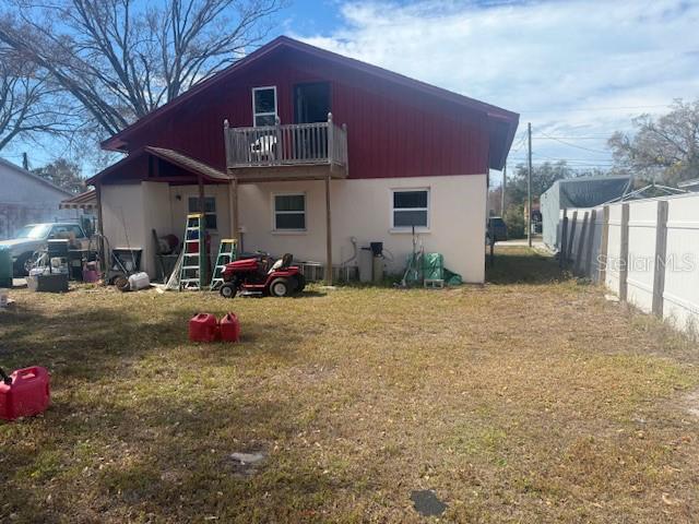13157 Clay Avenue Largo, FL 33773 - Photo 18 of 20 a front view of a house with a yard
