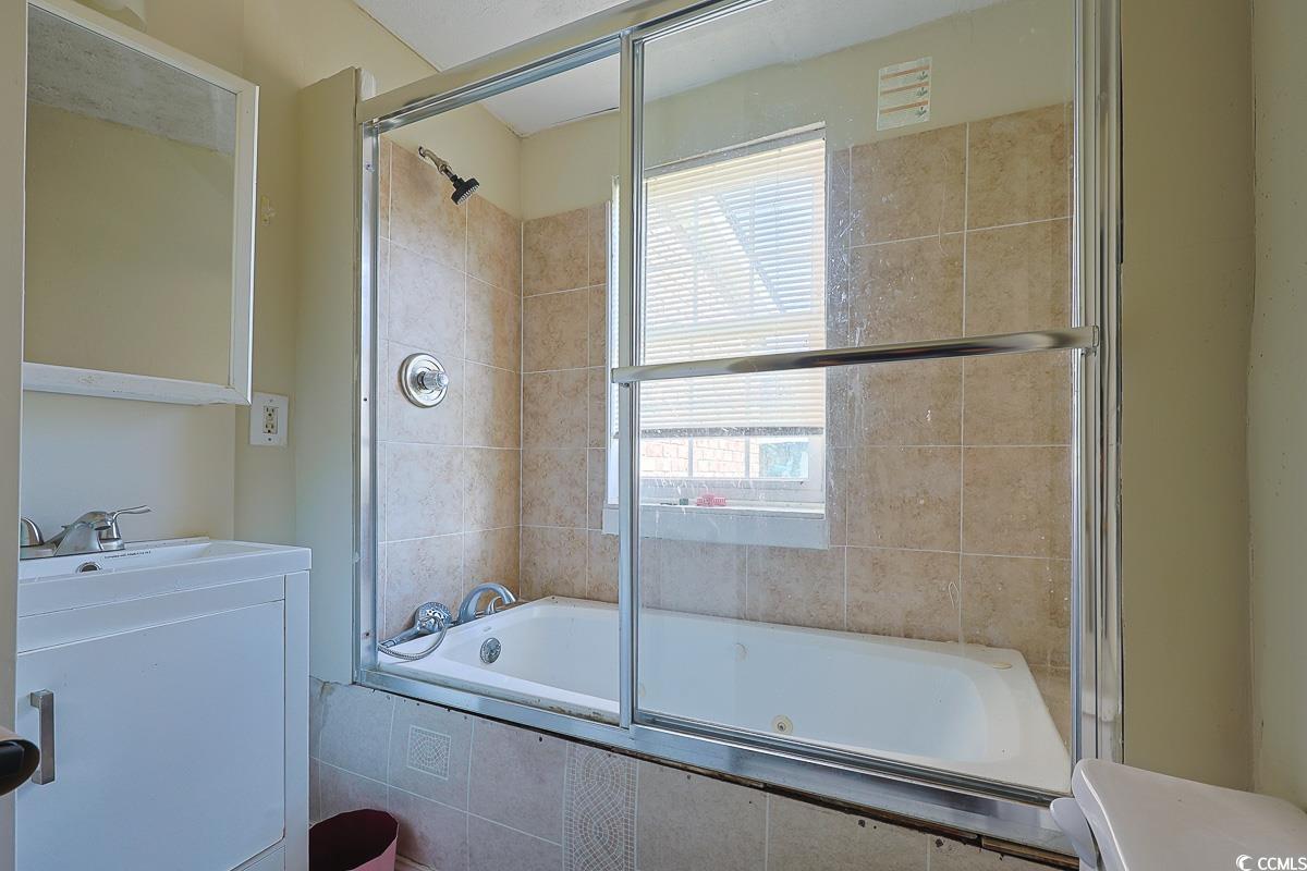 4300 Summit Trail Myrtle Beach, SC 29579 - Photo 18 of 39 Full bath with tiled shower / bath combo, plenty of natural light, and vanity