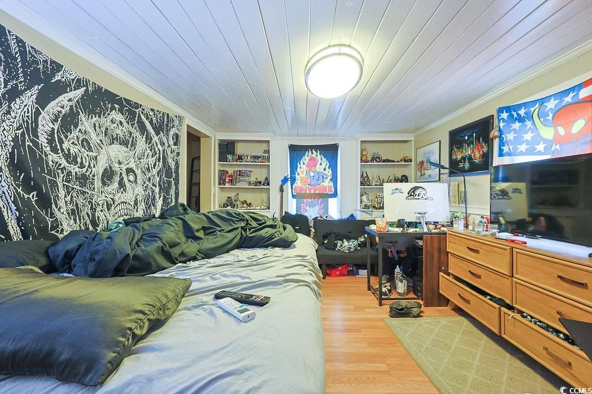 4300 Summit Trail Myrtle Beach, SC 29579 - Photo 31 of 39 Bedroom with light wood finished floors, ornamental molding, and wooden ceiling