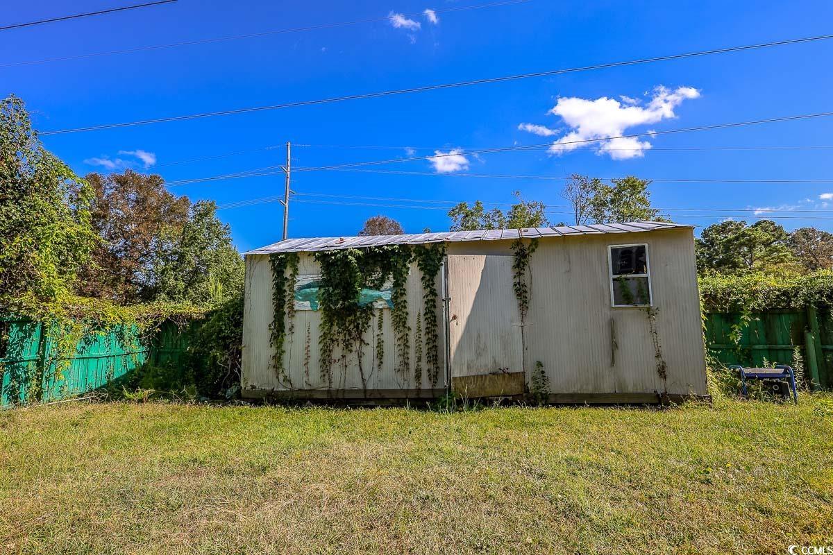 4300 Summit Trail Myrtle Beach, SC 29579 - Photo 36 of 39 View of side of property with an outbuilding and a metal roof