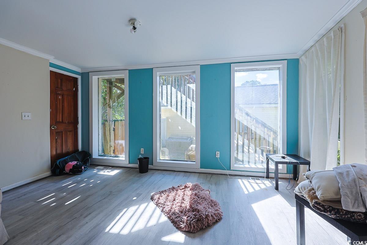 4300 Summit Trail Myrtle Beach, SC 29579 - Photo 4 of 39 Doorway to outside with wood finished floors and crown molding