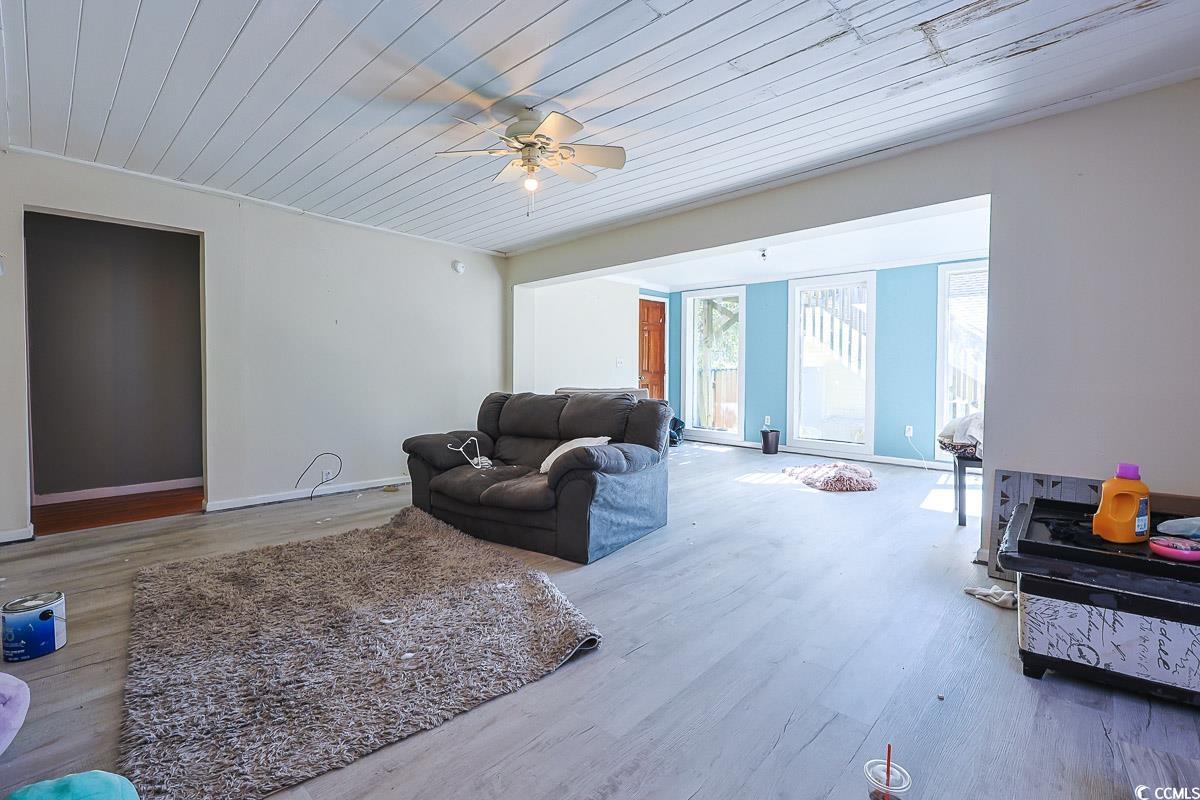 4300 Summit Trail Myrtle Beach, SC 29579 - Photo 5 of 39 Living area featuring wood finished floors, wood ceiling, and ceiling fan