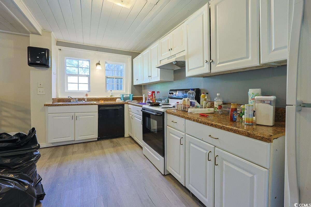 4300 Summit Trail Myrtle Beach, SC 29579 - Photo 8 of 39 Kitchen with white appliances, white cabinets, dark countertops, light wood-style floors, and wooden ceiling