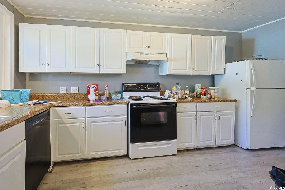 4300 Summit Trail Myrtle Beach, SC 29579 - Photo 9 of 39 Kitchen featuring white cabinets, white appliances, light wood finished floors, under cabinet range hood, and ornamental molding
