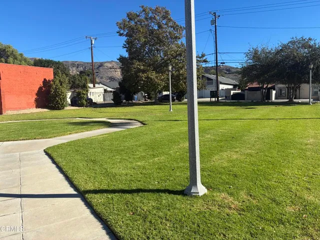 a view of a park with houses